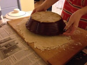 Roll out dough and use your pie plate to ensure that the dough will fill it, leaving about an inch extra around the plate.