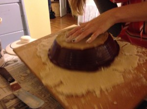 Use one hand to hold the pie plate and the other to flip the board (don't get hesitant here. It's like ripping off a bandaid-- the faster you go for it, the better)!