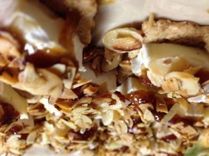 crackers with brie, fig jam, and toasted almonds
